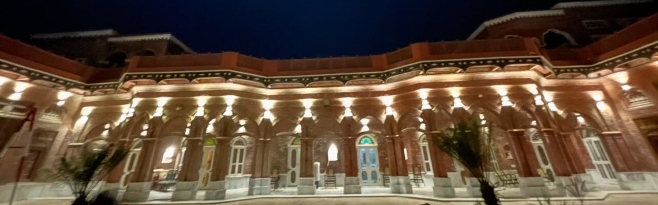 Arcade lit at dusk